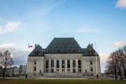 Main Building and headquarters of the Supreme Court of Canada, in Ottawa, Ontario. Also known as SCOC, it is the highest justice body of Canada

picture of the  the entrance of the Supreme Court of Canada, or Cour Supreme du Canada, in Ottawa. The Supreme Court of Canada is the highest court of Canada, the final court of appeals in the Canadian justice system. Its decisions are the ultimate expression and application of Canadian law and binding upon all lower courts of Canada